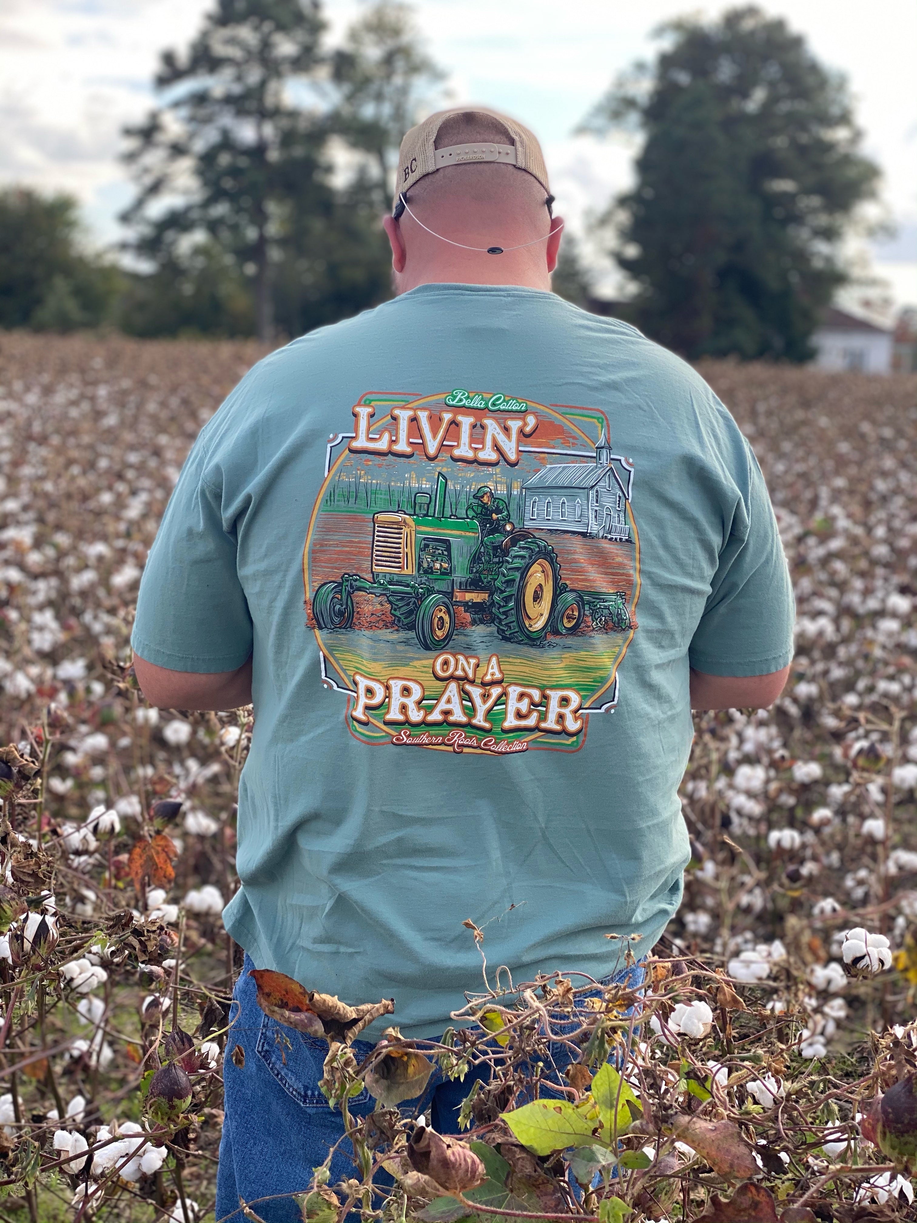 "Livin' on a Prayer" green short sleeve shirt with tractor image.