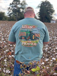 "Livin' on a Prayer" green short sleeve shirt with tractor image.